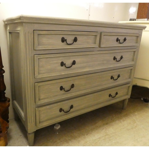 89 - A modern blue painted dressing chest with two short/three graduated long drawers, raised on turned f... 