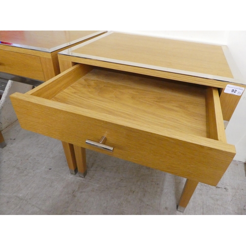 92 - A pair of modern light oak lamp tables, each with chrome trim and a drawer, raised on square legs&nb... 