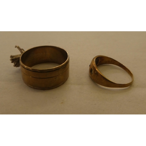 170 - A 9ct gold band ring, set with white stones; and a 9ct gold ring with apertures for stones