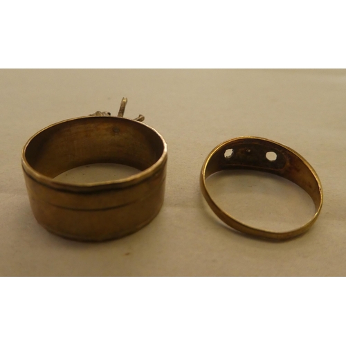 170 - A 9ct gold band ring, set with white stones; and a 9ct gold ring with apertures for stones