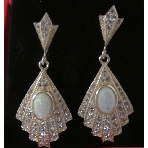 108 - A pair of silver coloured metal fan design, opal set drop earrings
