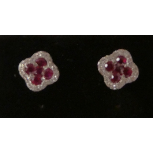 113 - A pair of 18ct gold, ruby and diamond clover leaf earrings