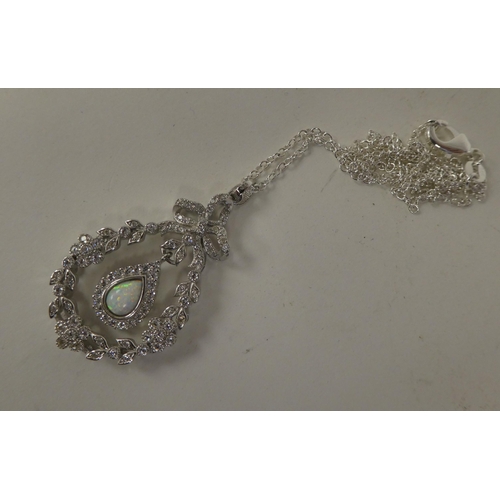 119 - A silver coloured metal belle-époque pendant, on a fine neckchain