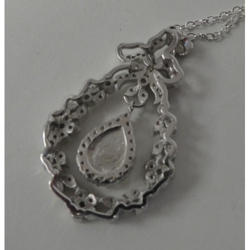 119 - A silver coloured metal belle-époque pendant, on a fine neckchain