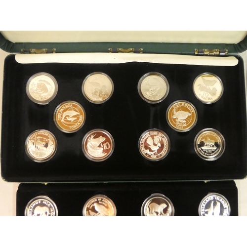 12 - A complete cased set of twenty-five silver proof coins, representing the World Wildlife Funds Countr... 