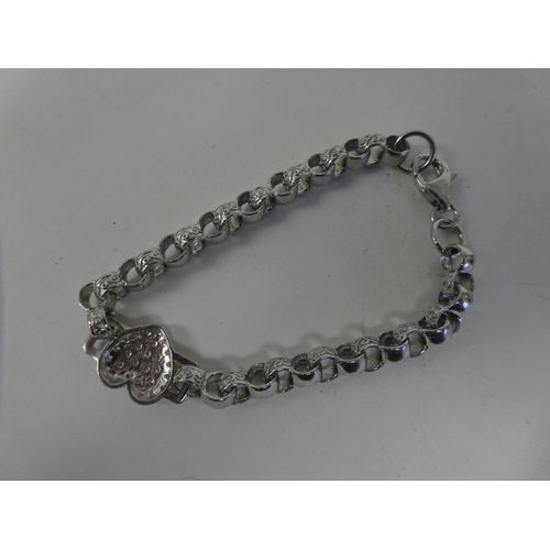 122 - A silver coloured metal bracelet, set with cubic zirconia
