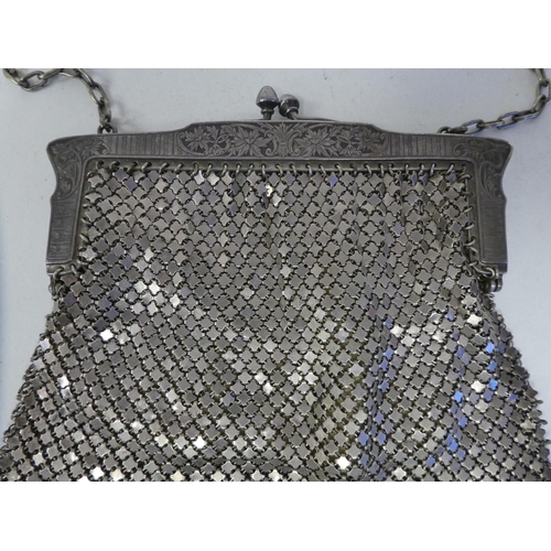 131 - Evening purses: to include an early 20thC Art Nouveau inspired silver plated chain mail example