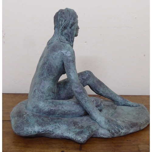 14 - A modern cast bronze figure, a seated nude  11