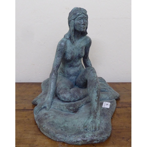 14 - A modern cast bronze figure, a seated nude  11