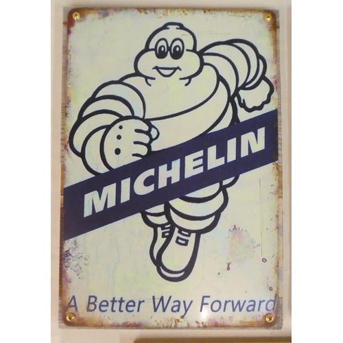 149 - Three reproduced printed advertising signs, viz. a Goodyear and two Michelin  12