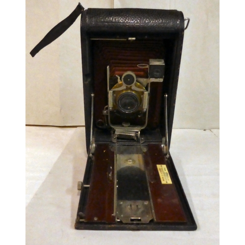 154 - A vintage Eastman Kodak Co bellows camera, folding into a black fabric finished case, in a moulded s... 