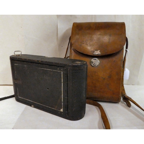 154 - A vintage Eastman Kodak Co bellows camera, folding into a black fabric finished case, in a moulded s... 