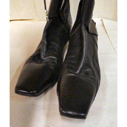 158 - A pair of Dior black leather knee high boots with a low heels and laced side detail  size 40