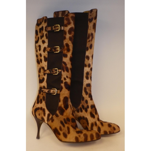 195 - A pair of Dolce & Gabbana knee high boots, in faux leopard with side buckle decoration  size 39