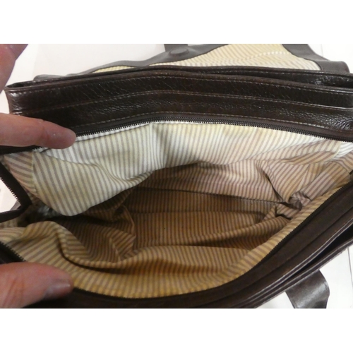 230 - A Radley brown hide handbag with a dust cover