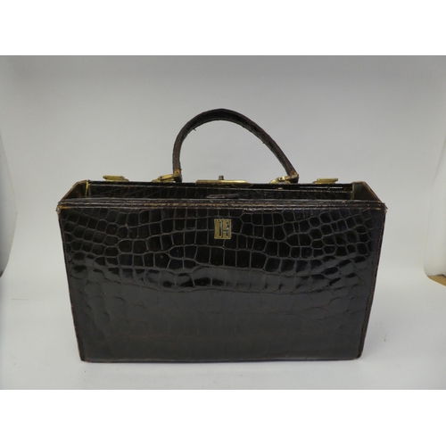 238 - A vintage crocodile skin Gladstone bag with gilt fittings  15