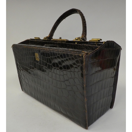 238 - A vintage crocodile skin Gladstone bag with gilt fittings  15