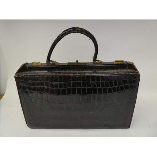 238 - A vintage crocodile skin Gladstone bag with gilt fittings  15