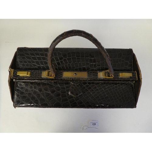 238 - A vintage crocodile skin Gladstone bag with gilt fittings  15