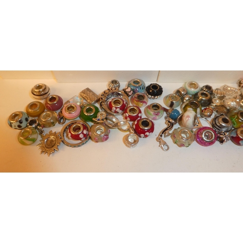 25 - Eight Pandora gift boxes; and Pandora style coloured bead charms