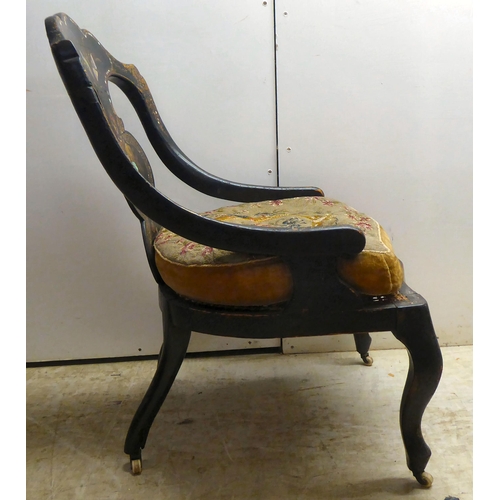 324 - A Regency black lacquered, overpainted, mother-of-pearl inlaid and gilded splat back nursing chair w... 