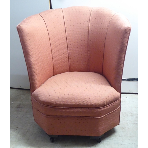 328 - A 1930s and later fabric upholstered bedroom chair, on block feet and casters