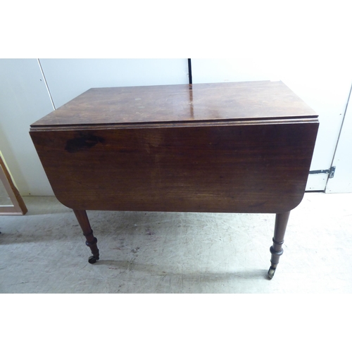 329 - A late Victorian mahogany Pembroke table, raised on ting turned, tapered legs and brass capped caste... 