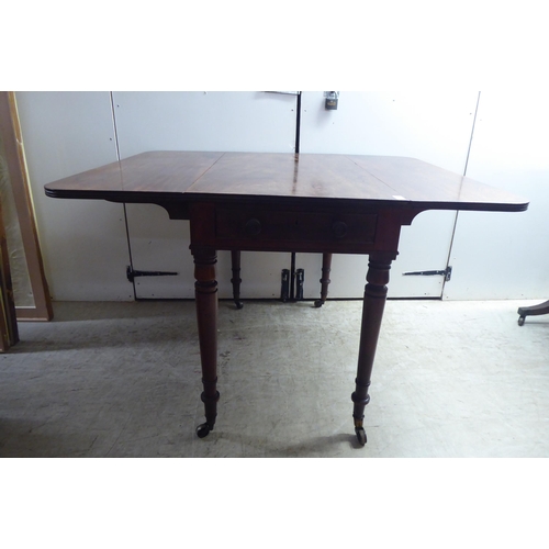 329 - A late Victorian mahogany Pembroke table, raised on ting turned, tapered legs and brass capped caste... 