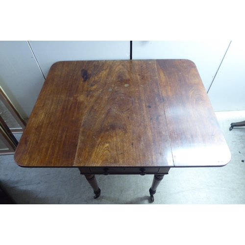 329 - A late Victorian mahogany Pembroke table, raised on ting turned, tapered legs and brass capped caste... 