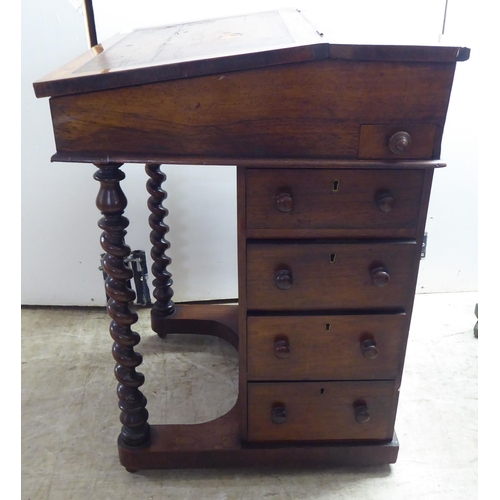 331 - A late Victorian rosewood veneered Davenport with a bank of four right hand drawers, on a concave pl... 