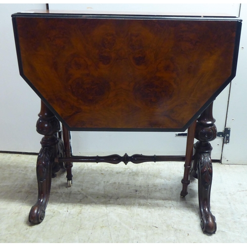 341 - A late Victorian ebonised walnut veneered and mahogany Sutherland table, raised on turned, carved, s... 