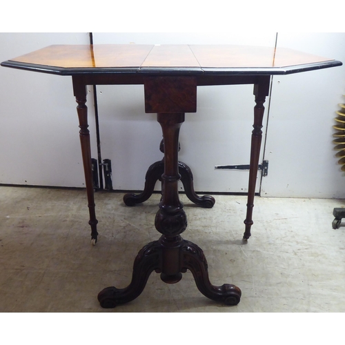 341 - A late Victorian ebonised walnut veneered and mahogany Sutherland table, raised on turned, carved, s... 