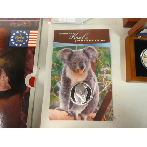 4 - Variously themed proof coins: to include American, Canadian, and New Zealand
