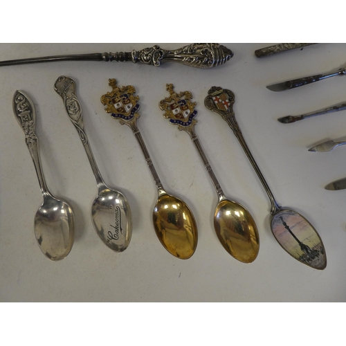 48 - Silver and white metal items: to include spoons; a pepper mill; and hair brushes  mixed marks