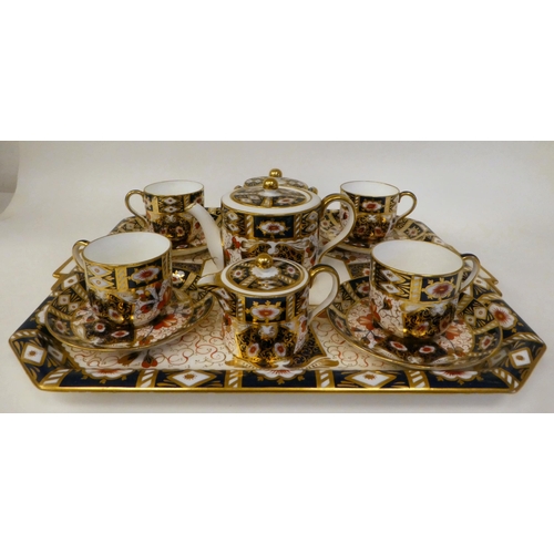 63 - A Wedgwood china Old Imari pattern tea set  comprising a drum design teapot, a twin handled sugar ba... 