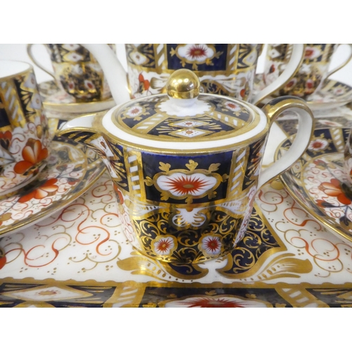 63 - A Wedgwood china Old Imari pattern tea set  comprising a drum design teapot, a twin handled sugar ba... 