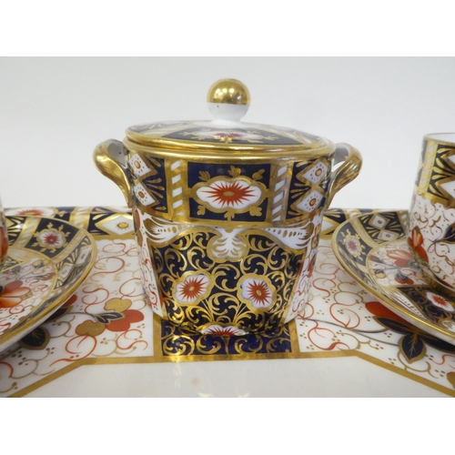 63 - A Wedgwood china Old Imari pattern tea set  comprising a drum design teapot, a twin handled sugar ba... 