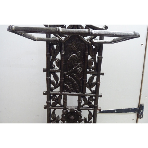 7 - A Victorian style faux bamboo cast iron stickstand  24