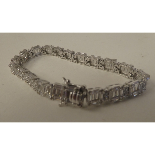 70 - A silver coloured metal and cubic zirconia block link bracelet  stamped 925