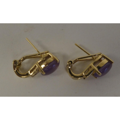 75 - A pair of gold coloured metal, amethyst and diamond set earrings  stamped 10k