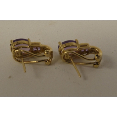 75 - A pair of gold coloured metal, amethyst and diamond set earrings  stamped 10k