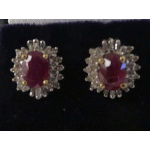 77 - A pair of 14ct gold, claw set, ruby and diamond earrings