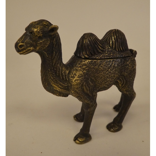 80 - A brass novelty vesta case, fashioned as a camel with a hinged cap