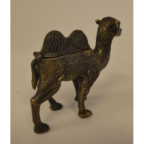 80 - A brass novelty vesta case, fashioned as a camel with a hinged cap