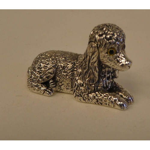 91 - A miniature Sterling silver model, a seated poodle