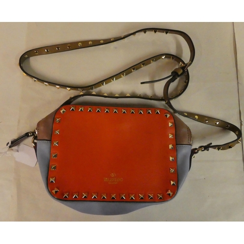 106 - A Valentino Garavani Rockstud shoulder bag, in tan, red and pale blue