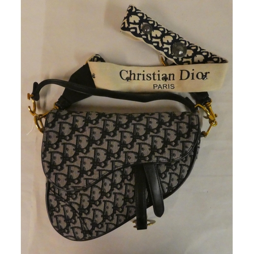 109 - A Christian Dior, Paris blue fabric and leather trimmed 'triangle' handbag with dust cover