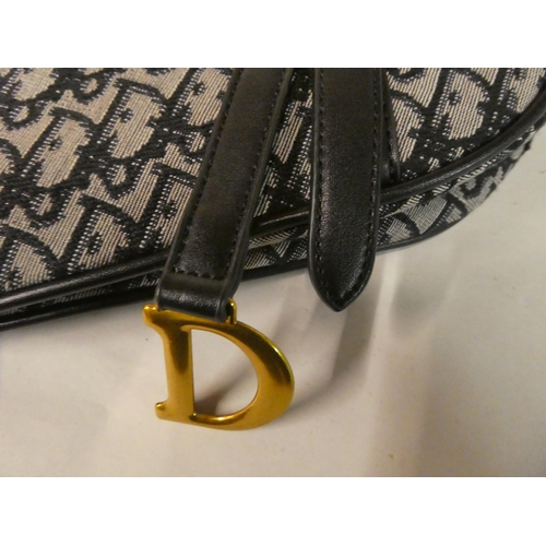 109 - A Christian Dior, Paris blue fabric and leather trimmed 'triangle' handbag with dust cover
