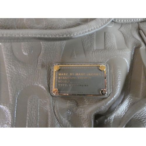 118 - A Bottega Veneta woven black leather shoulder bag with a dust cover; and a Marc by Marc Jacobs dark ... 