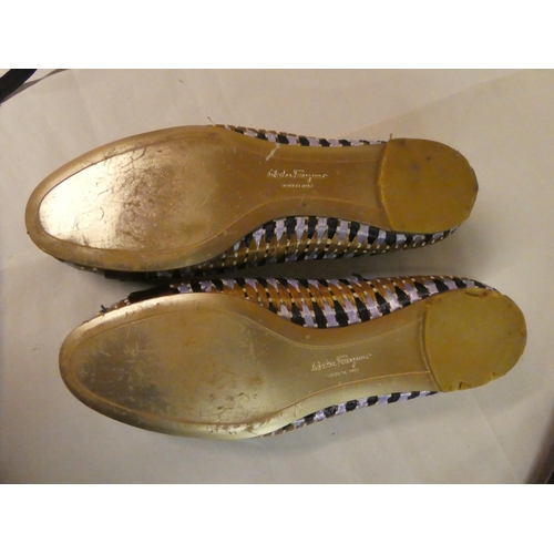 125 - A pair of Gucci gold coloured sandals with dust cover  size 39C; a pair of raffia finished Ferrangam... 